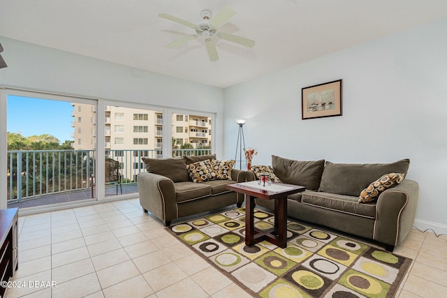 living room with ceiling fan and light tile patterned floors