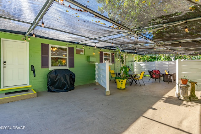 view of patio / terrace with a pergola and a grill