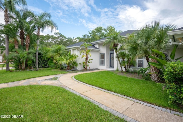 2 Creek Bend Way, Ormond Beach, FL 32174 - view of front of property featuring stucco siding and a front yard