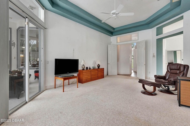2 Creek Bend Way, Ormond Beach, FL 32174 - living area with carpet flooring, a ceiling fan, and a towering ceiling