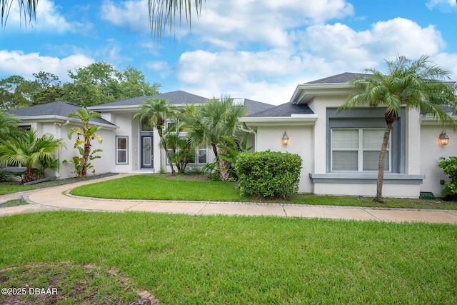2 Creek Bend Way, Ormond Beach, FL 32174 - view of front facade featuring stucco siding and a front lawn