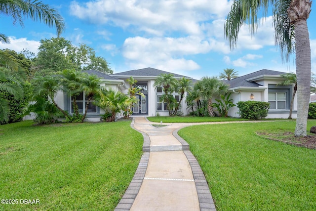 2 Creek Bend Way, Ormond Beach, FL 32174 - view of front facade featuring stucco siding and a front yard