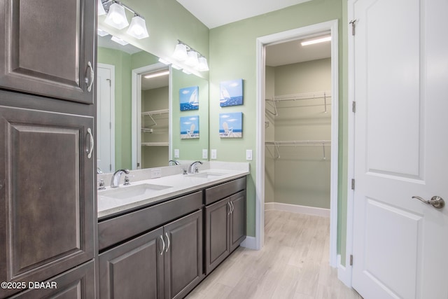 bathroom with vanity and wood-type flooring