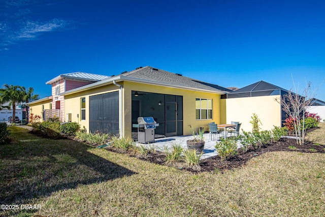 back of property featuring a patio area and a lawn