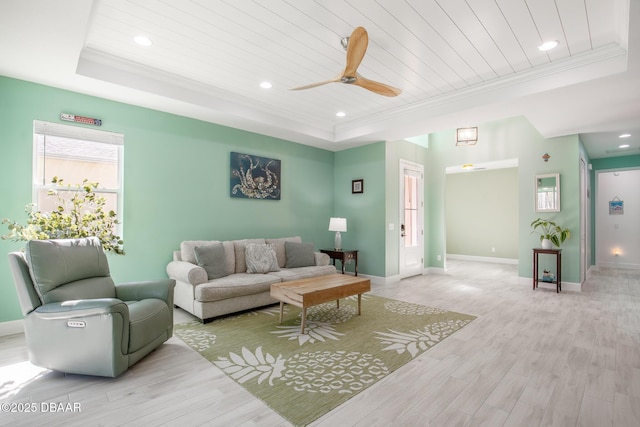 living room featuring crown molding, light hardwood / wood-style flooring, wooden ceiling, and a raised ceiling