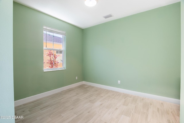 unfurnished room featuring light hardwood / wood-style floors