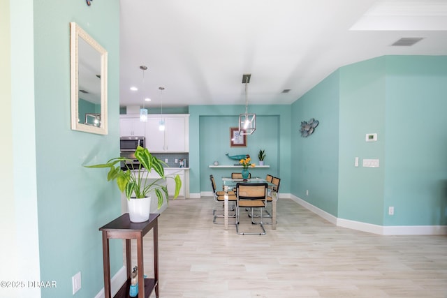 dining room with light wood-type flooring