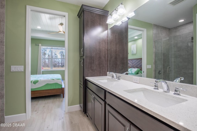 bathroom with vanity and an enclosed shower