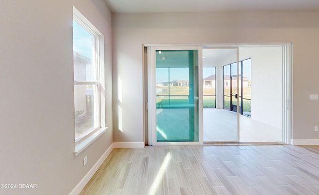 doorway with light hardwood / wood-style flooring