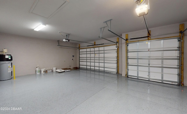 garage featuring a garage door opener and water heater