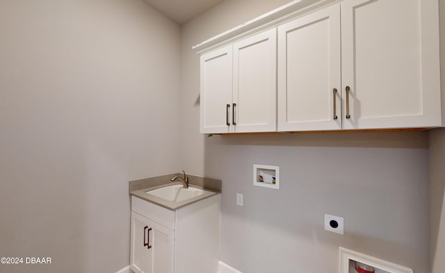 laundry room with washer hookup, electric dryer hookup, cabinets, and sink