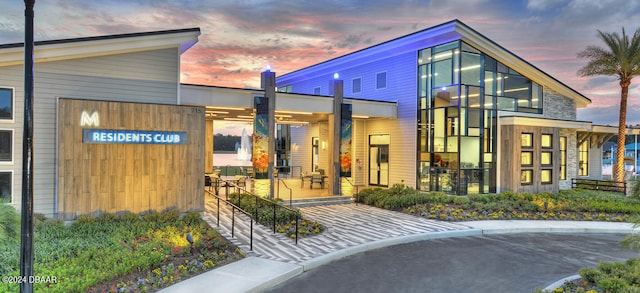 view of outdoor building at dusk