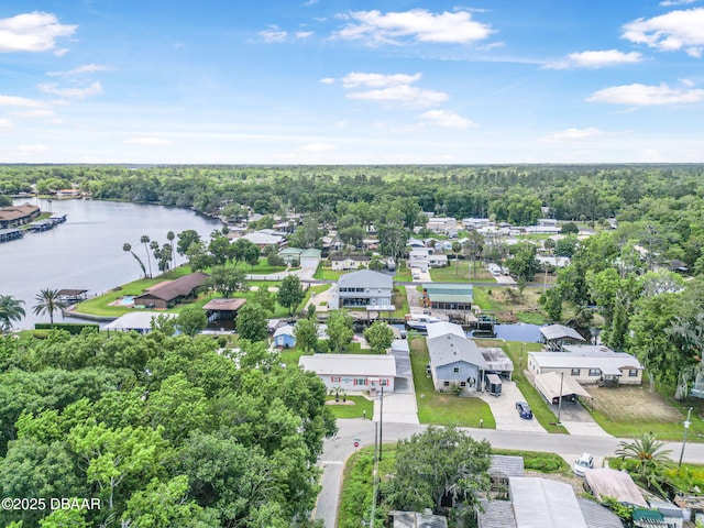 bird's eye view with a residential view, a water view, and a forest view