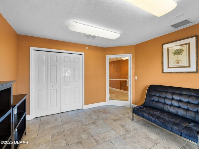2403 S Atlantic Ave Unit 410, Daytona Beach, FL 32118 - living area featuring a textured ceiling and baseboards