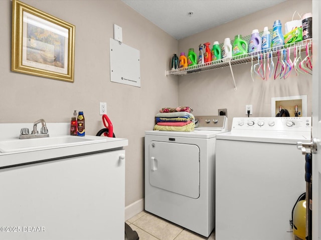 2403 S Atlantic Ave Unit 410, Daytona Beach, FL 32118 - laundry room featuring washer and clothes dryer and light tile patterned flooring