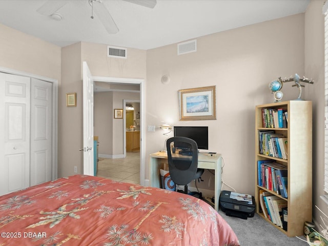 2403 S Atlantic Ave Unit 410, Daytona Beach, FL 32118 - tiled bedroom featuring a closet, ceiling fan, baseboards, and a desk