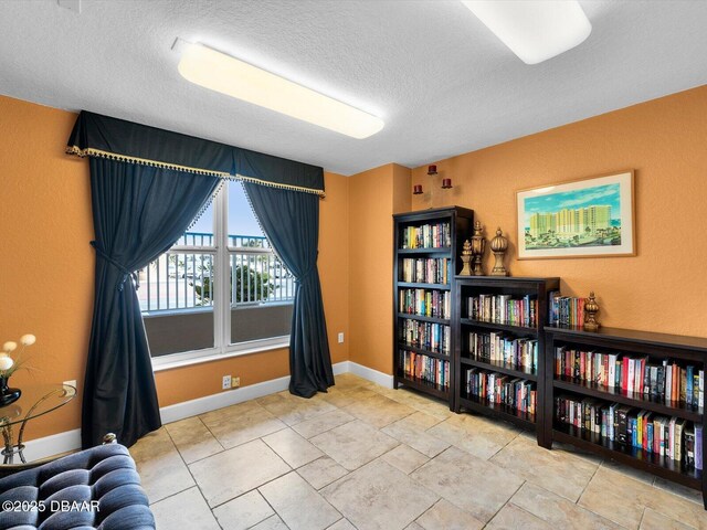 2403 S Atlantic Ave Unit 410, Daytona Beach, FL 32118 - living area with a textured ceiling and baseboards