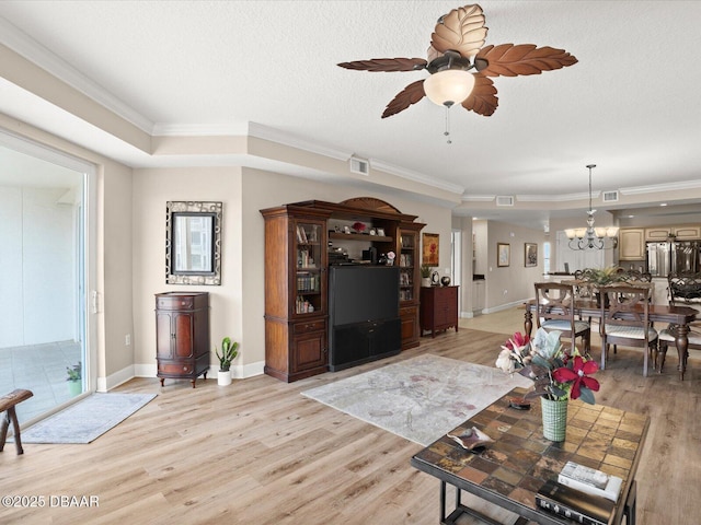 2403 S Atlantic Ave Unit 410, Daytona Beach, FL 32118 - living area with crown molding, a chandelier, light wood finished floors, ceiling fan, and baseboards