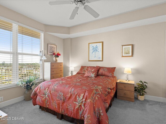 2403 S Atlantic Ave Unit 410, Daytona Beach, FL 32118 - carpeted bedroom featuring baseboards and a ceiling fan