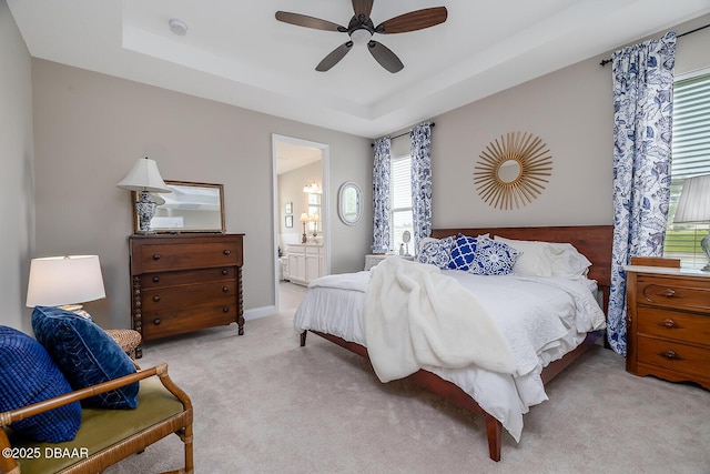 3013 Kenmare St, Ormond Beach, FL 32174 - bedroom with carpet, a tray ceiling, ensuite bathroom, and a ceiling fan