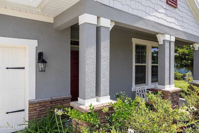 3013 Kenmare St, Ormond Beach, FL 32174 - doorway to property with a porch and stucco siding