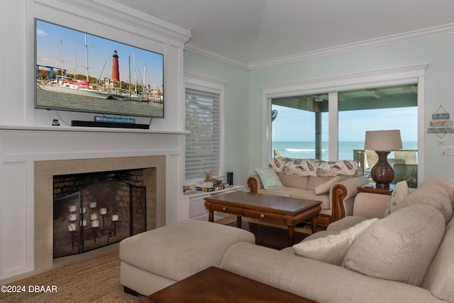 living room featuring a water view and ornamental molding