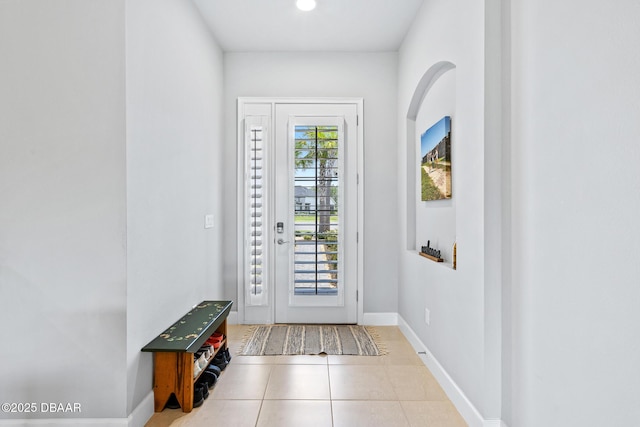 6423 Hanfield Ln, Port Orange, FL 32128 - doorway featuring tile patterned flooring and baseboards