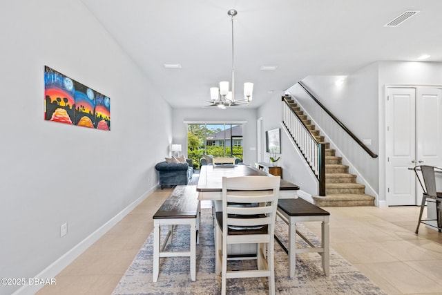6423 Hanfield Ln, Port Orange, FL 32128 - dining space featuring stairway, light tile patterned floors, and a chandelier