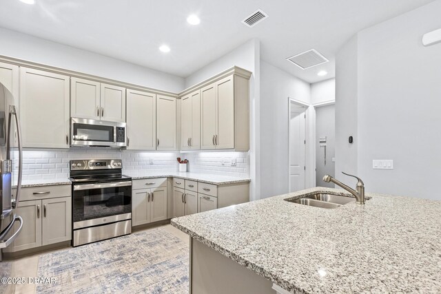 6423 Hanfield Ln, Port Orange, FL 32128 - kitchen featuring stainless steel appliances, light stone counters, decorative backsplash, and recessed lighting