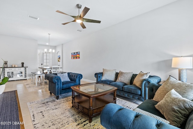 6423 Hanfield Ln, Port Orange, FL 32128 - living area featuring a chandelier, a ceiling fan, and light tile patterned floors