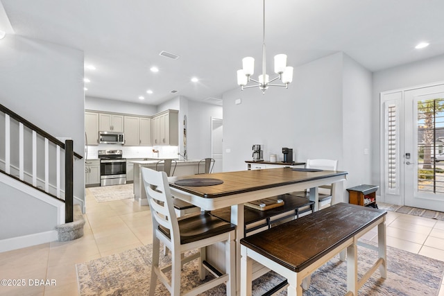 6423 Hanfield Ln, Port Orange, FL 32128 - dining area with light tile patterned flooring, a chandelier, stairs, and recessed lighting