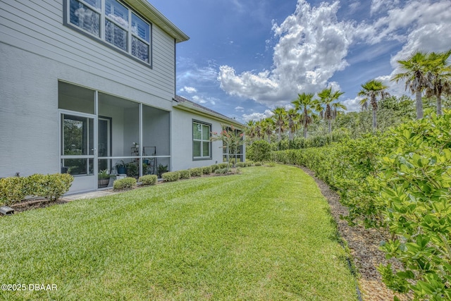 6423 Hanfield Ln, Port Orange, FL 32128 - view of grassy yard with a sunroom