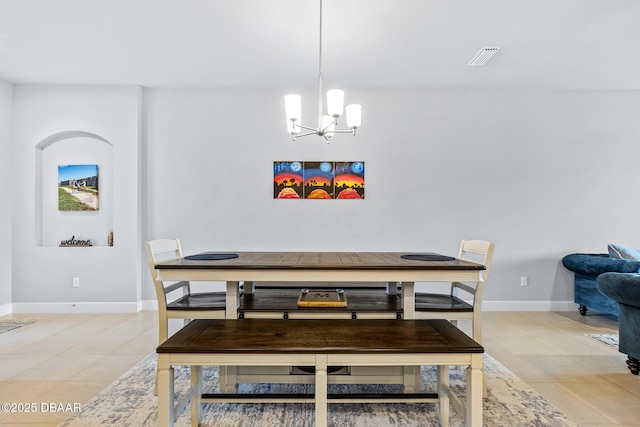 6423 Hanfield Ln, Port Orange, FL 32128 - dining area with light tile patterned floors and a chandelier