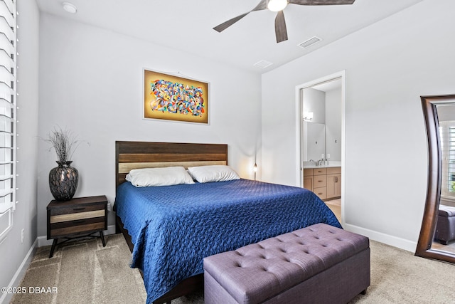 6423 Hanfield Ln, Port Orange, FL 32128 - bedroom featuring carpet, ensuite bath, and a ceiling fan