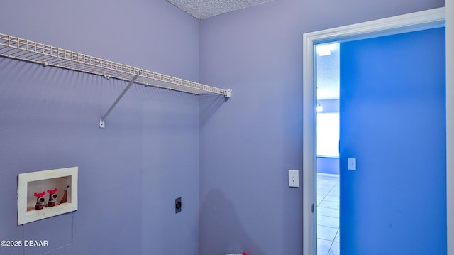 laundry area with electric dryer hookup, hookup for a washing machine, laundry area, and a wealth of natural light
