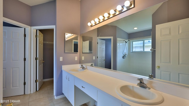 full bathroom featuring tile patterned floors, a sink, double vanity, and tiled shower