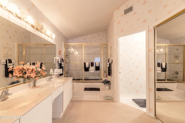 bathroom with a shower with door, tile patterned flooring, a textured ceiling, vaulted ceiling, and vanity