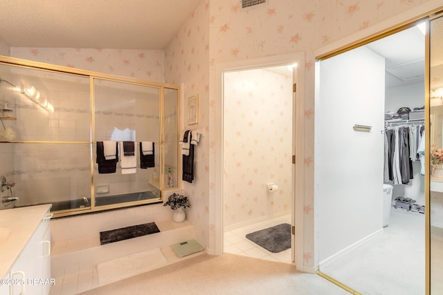 bathroom featuring vanity, tile patterned floors, and walk in shower