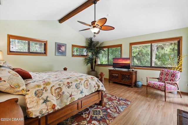 bedroom featuring lofted ceiling with beams, light wood-type flooring, and ceiling fan