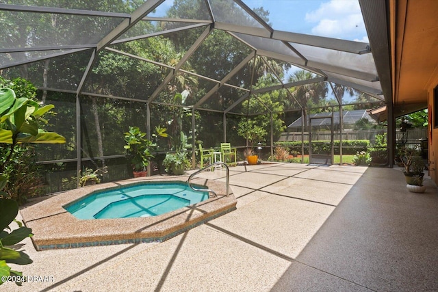 view of swimming pool with a lanai and a patio