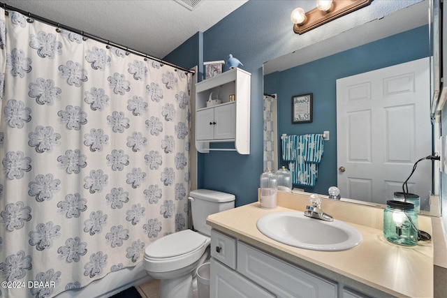 bathroom with vanity, walk in shower, a textured ceiling, and toilet