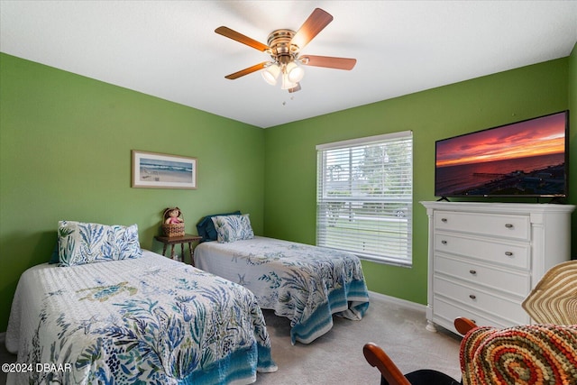 bedroom with light carpet and ceiling fan