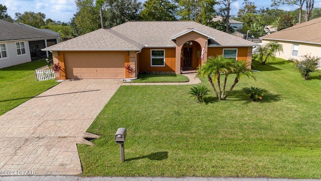 ranch-style house featuring a garage and a front yard