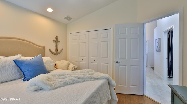 1453 Sunningdale Ln, Ormond Beach, FL 32174 - bedroom featuring visible vents, wood finished floors, a closet, lofted ceiling, and recessed lighting