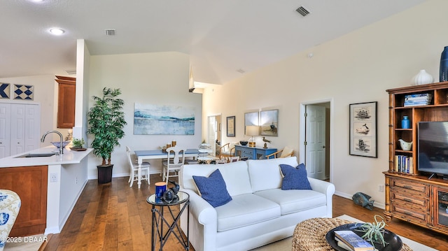 1453 Sunningdale Ln, Ormond Beach, FL 32174 - living area with hardwood / wood-style flooring, visible vents, baseboards, and lofted ceiling