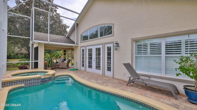 1453 Sunningdale Ln, Ormond Beach, FL 32174 - view of pool with a patio, french doors, an outdoor living space, glass enclosure, and a pool with connected hot tub