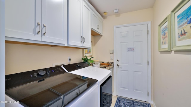 1453 Sunningdale Ln, Ormond Beach, FL 32174 - washroom with baseboards, washing machine and dryer, and cabinet space
