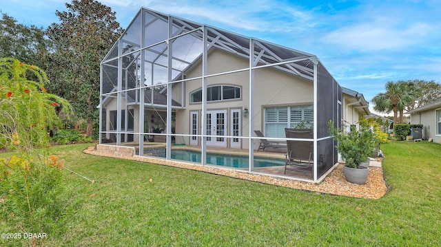 1453 Sunningdale Ln, Ormond Beach, FL 32174 - back of house with stucco siding, a patio area, french doors, a lanai, and a lawn