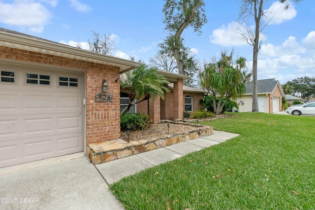 ranch-style home with a front lawn and a garage