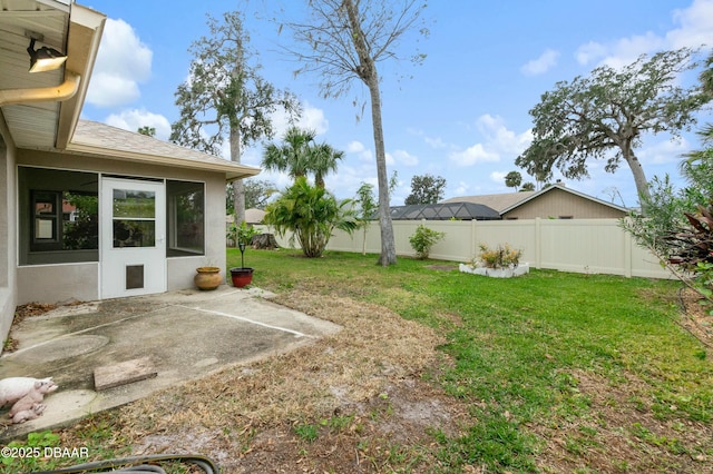 view of yard with a patio and a sunroom